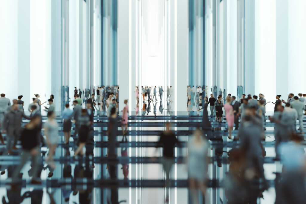 Modern glass office lobby with business people